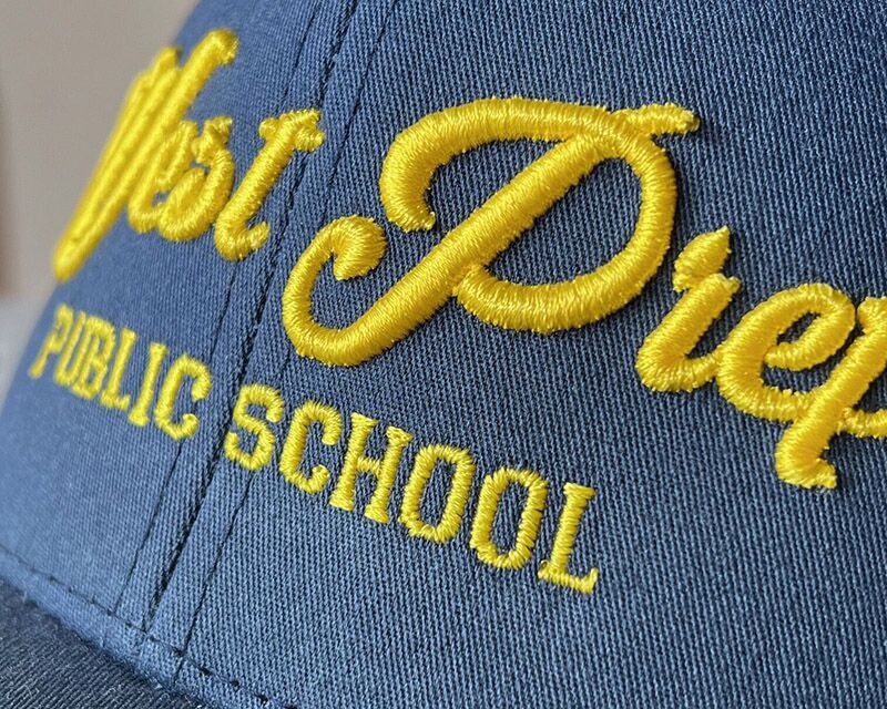 Showcasing custom 3D embroidery on hat.