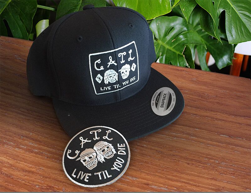 A cap and embroidered patch customized with band logo.