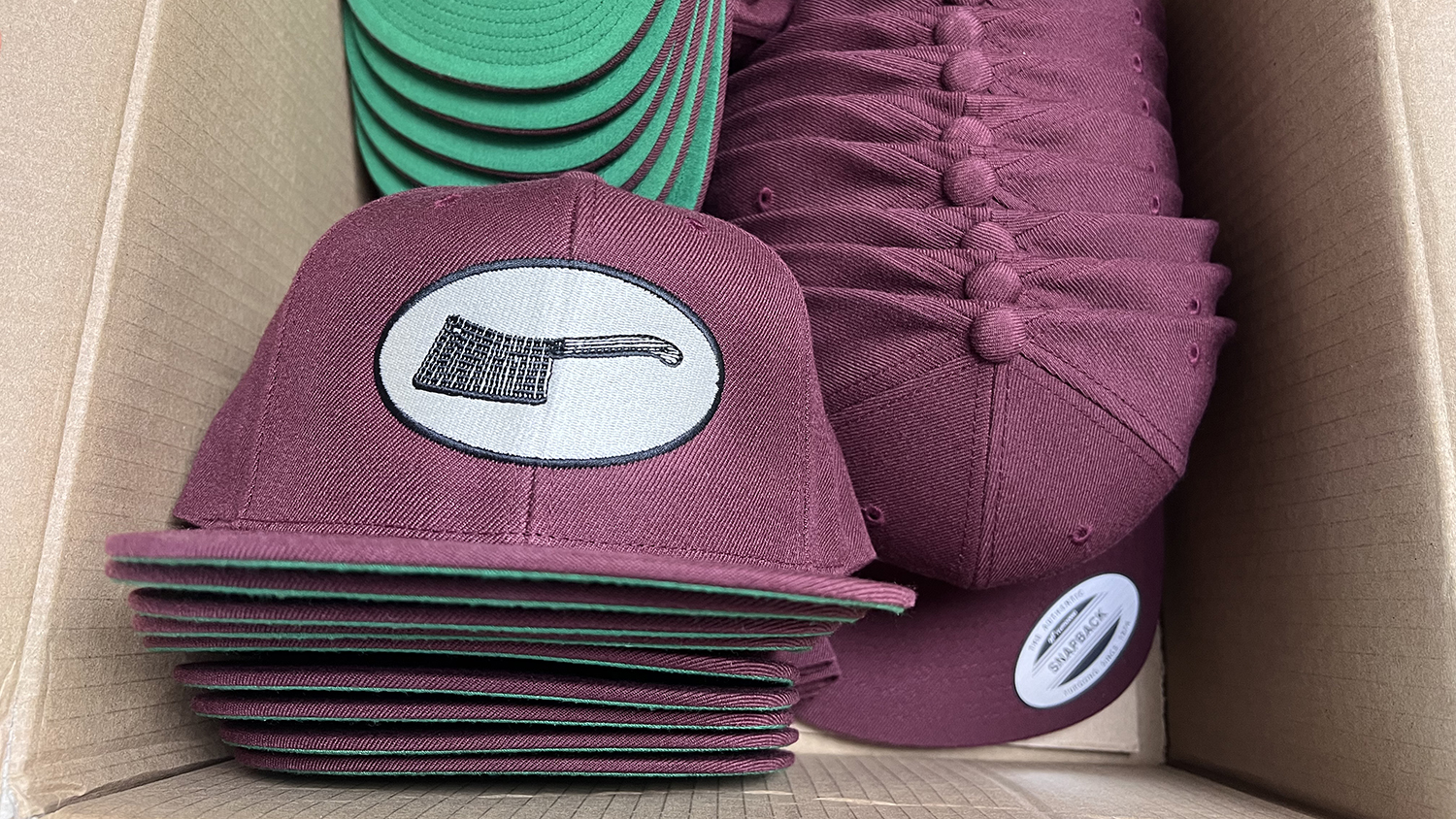 embroidered snapback hat with sanagans logo